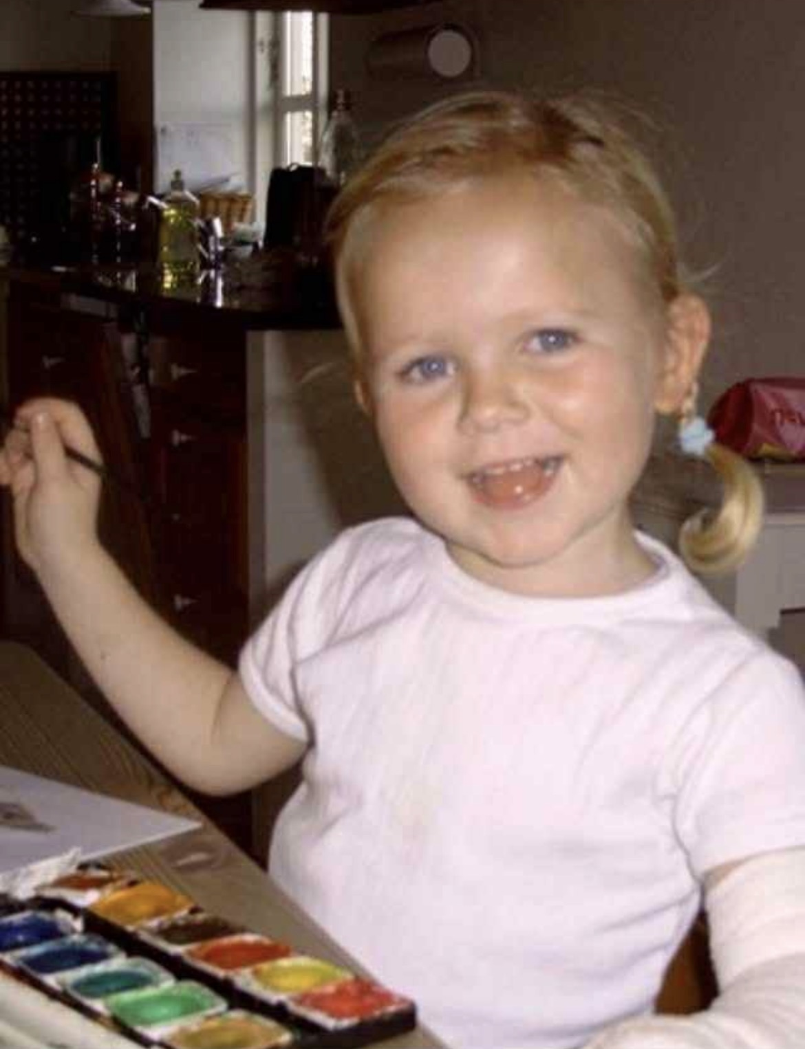 Signe painting as a child